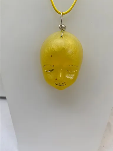 Resin face yellow pendant glow.