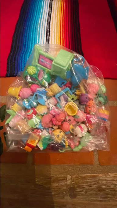 Assorted bag of Shopkins and misc small toys- 8.4 oz bag