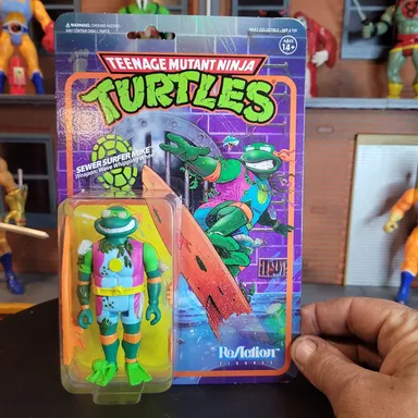 Super 7 Teenage Mutant Ninja Turtles: Sewer Surfer Mike Reaction Figure