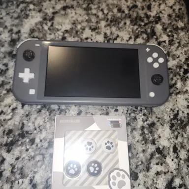 Nintendo Switch Lite. Grey (Console) + Cats paws grips