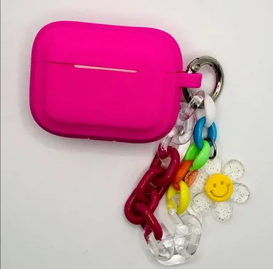 Hot pink earphone case with charm detail