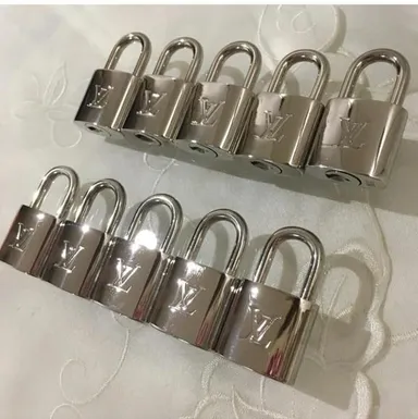 Louis Vuitton Silver padlock and key