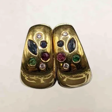 18kt yellow gold huggie earrings set with diamonds and multiple gemstones